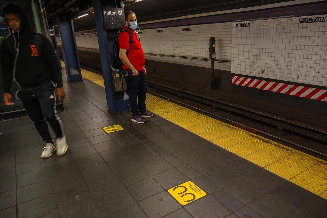 A social distance marker on the subway platform with horseshoe shape